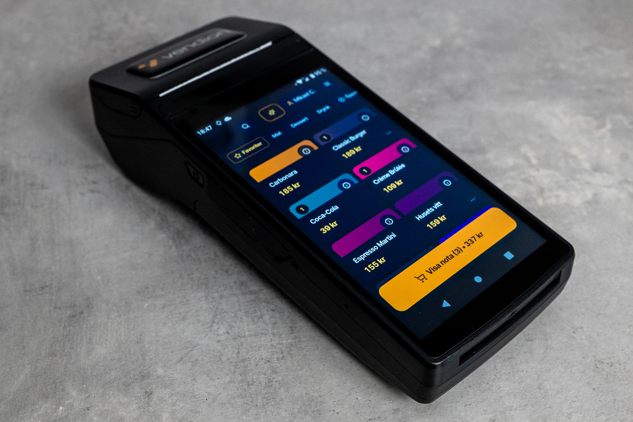 Vendion AIO — handheld device with Vendion's POS, card terminal and receipt printer in one